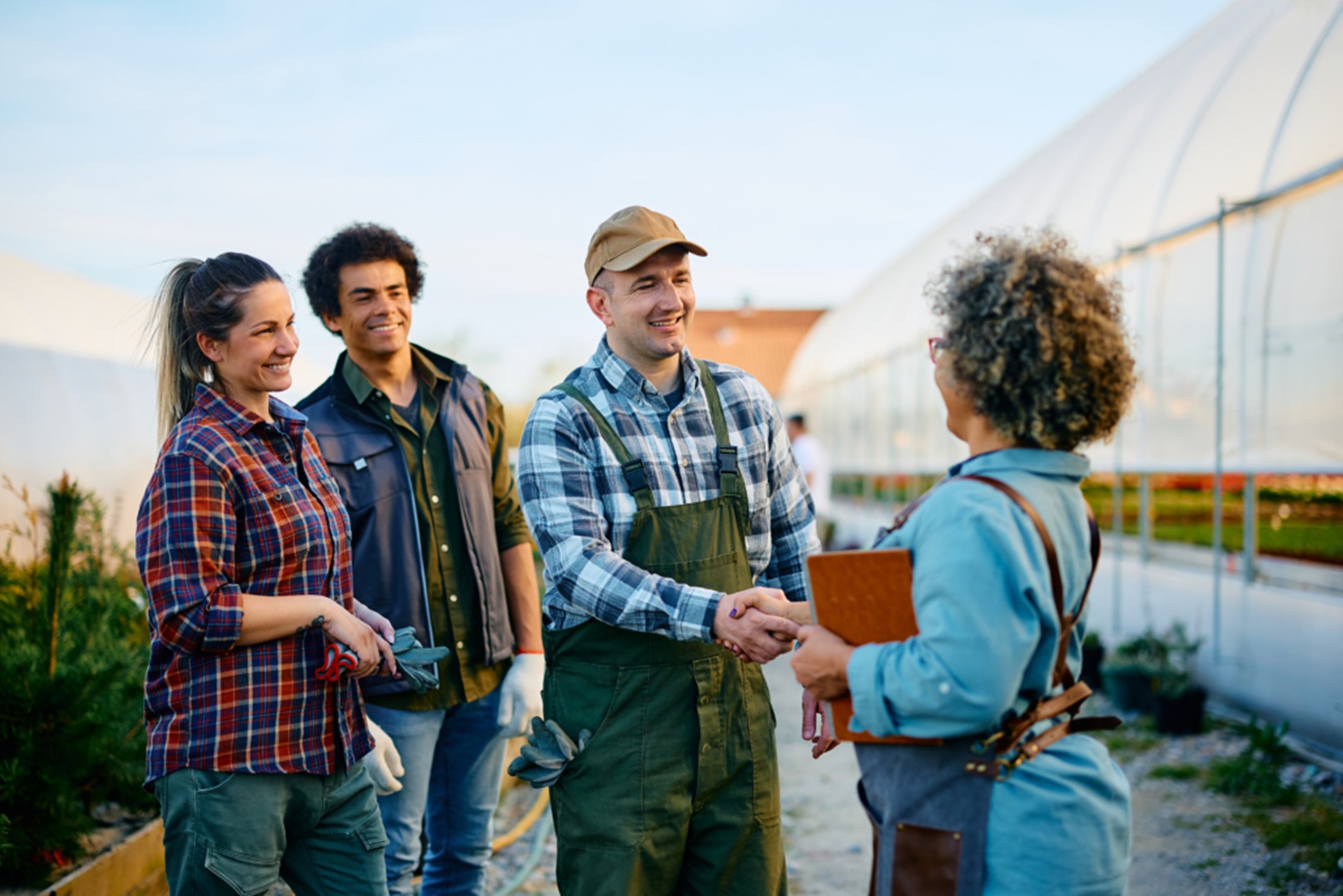 Agricultural team meeting in greenhouse